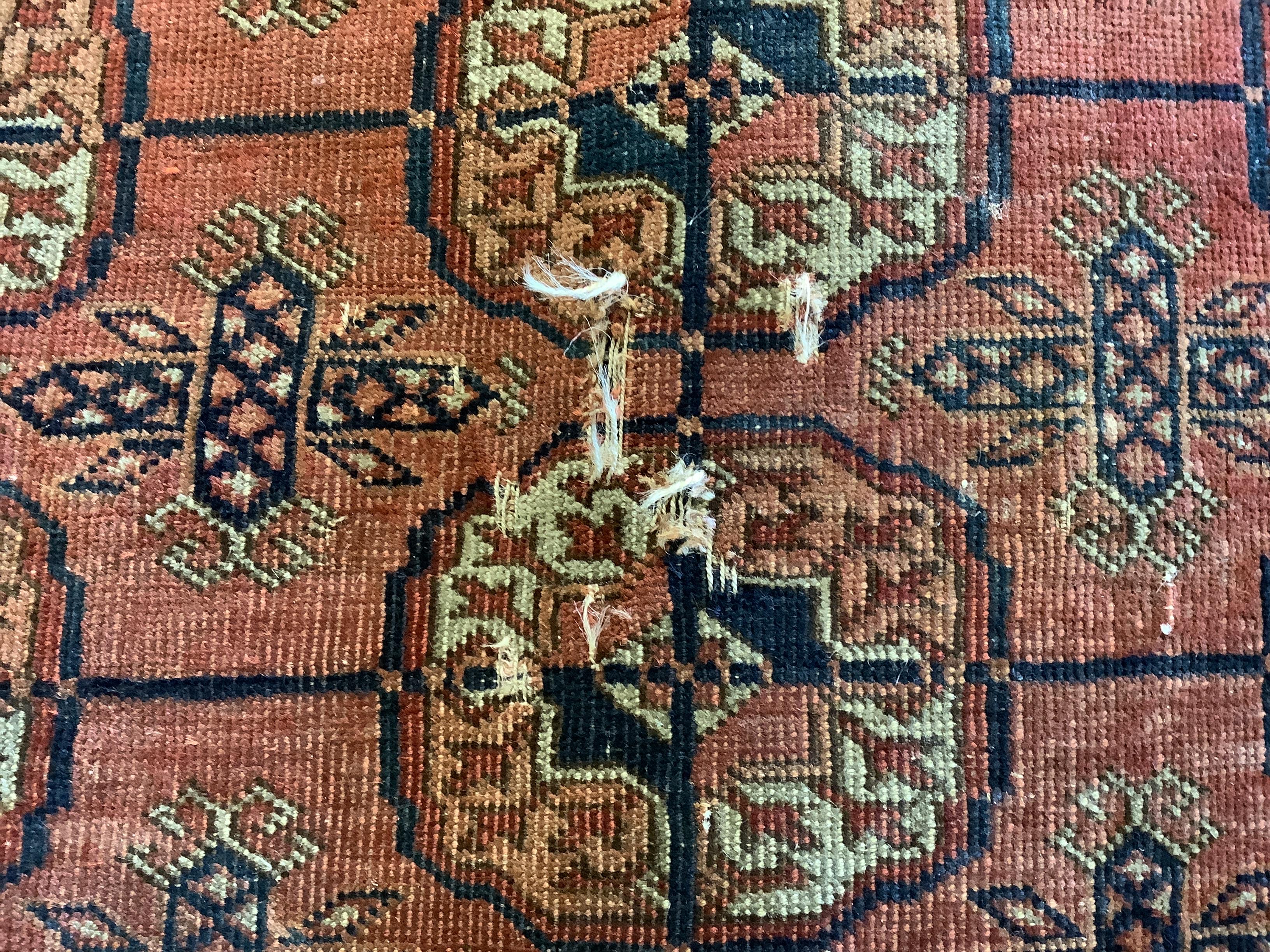 An antique Bokhara rug, 132 x 116cm